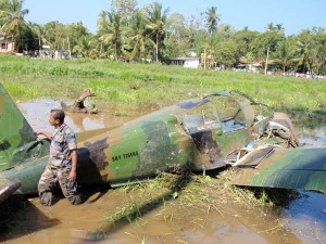 LTTE s precision targeting. A SLAF person inspecting the wreckage